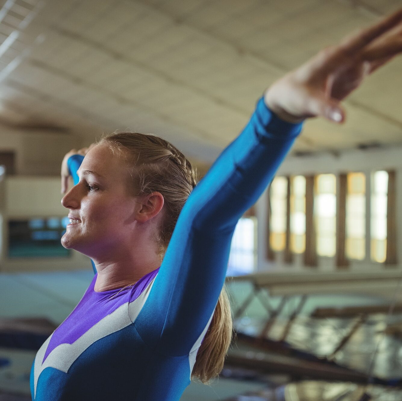 Female gymnast practicing gymnastics
